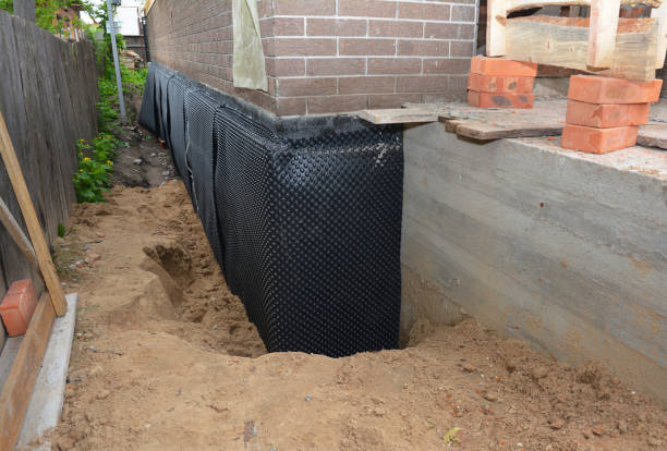 SJ Waterproofing Pros technician performing targeted Emergency Waterproofing assessment in Clyde, NY